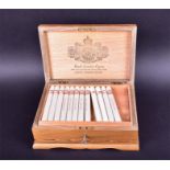 A walnut and parquetry inlaid cigar box and 57 'custom rolled' cigars the hinged lid stamped to