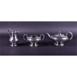 A Victorian silver three-piece tea set by Walter & John Barnard, London 1877, comprising a teapot,