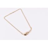 A 14ct yellow gold and diamond necklace the asymmetric pendant with ten individually collet-set