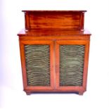 A Victorian flamed mahogany veneered chiffonier with brass wired panels to each door, opening to