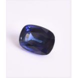 An unmounted rectangular cushion-cut synthetic sapphire measuring 18.1 x 13.48 x 9 mm.