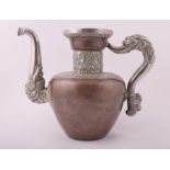 A late 19th century Tibetan copper and white metal teapot of tapering cylindrical form with