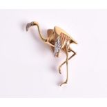 An Art Deco style diamond brooch in the form of a flamingo, in 14ct yellow gold. CONDITION REPORT