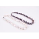 A cultured white pearl necklace with white metal clasp, pearls 15 mm diameter, together with another