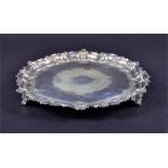 An Edwardian silver salver by Walker & Hall, Sheffield 1903, of circular form with scroll decoration
