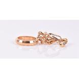 An 18ct yellow gold puzzle ring size L 1/2, together with an 18ct yellow gold a band ring size L,