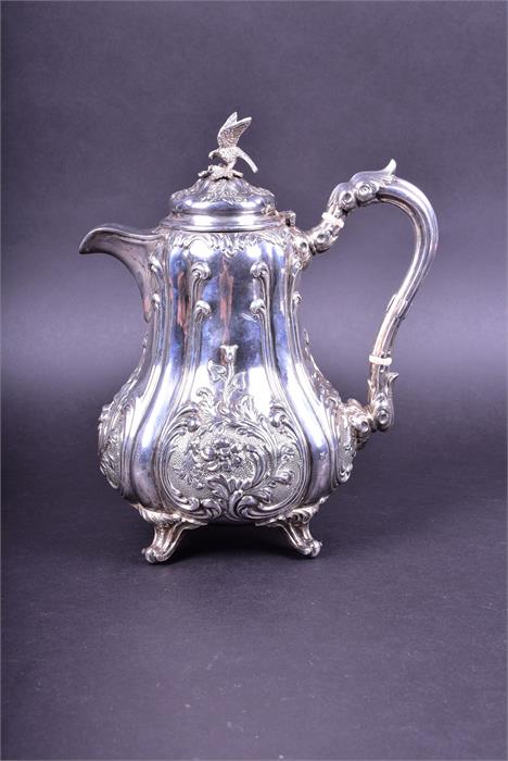 A George V silver teapot in the Victorian style by Walker & Hall, Sheffield 1923, the cover with