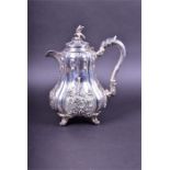 A George V silver teapot in the Victorian style by Walker & Hall, Sheffield 1923, the cover with