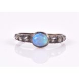 A late 19th / early 20th century opal and diamond ring size O, 2.1 grams.