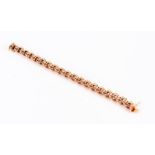 A heavy rose gold bracelet of articulated rope-link design, the clasp stamped 585, 20 cm long, 38