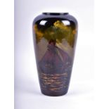 An early 20th century tall vase in the manner of Wardle with an underglaze sgrafitto continuous