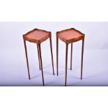 A pair of 20th century satinwood veneered plant stands in the Sheraton Revival style, with single