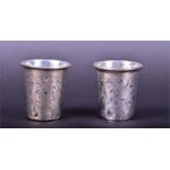 A pair of 19th century Russian vodka cups with engraved foliate decoration, stamped 84, Moscow 1873.