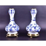 A pair of Continental blue and white bottle vases, possibly by Meissen  with underglaze decoration