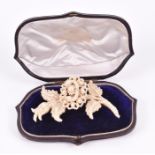 A late 19th / early 20th century seed pearl floral brooch the mother-of-pearl base elaborately