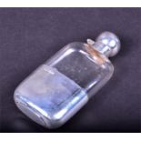 An Edwardian silver and glass hip flask Birmingham 1910 by James Dixon & Sons, with hinged cap,