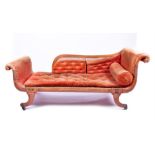 A Regency mahogany scrolled end chaise longue with bergere panelled back, upholstered arms and seat,