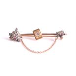 A diamond bar brooch terminating at each end with a fox's head set with old-cut, single-cut and