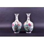 A pair of 19th century Chinese porcelain vases the ovoid shaped bodies decorated with enamelled