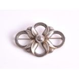 A Georg Jensen silver brooch numbered 305, the central silver pearl highlighted with four stylised