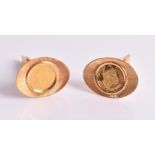 A pair of coin cufflinks each inset with a Venezuela Guaicamacuto coin, in 18ct yellow gold mount.