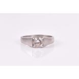 A solitaire diamond ring centred with a round brilliant-cut diamond weighing 0.7374 carats, in