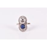 A diamond and sapphire ring in the Art Deco taste, the figure-of-eight mount set with a round