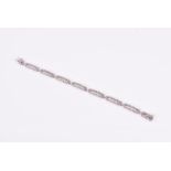 Wempe. An 18ct white gold and diamond bracelet the openwork segmented links set with round