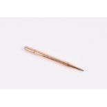 A 9ct yellow gold propelling pencil with engine-turned finish, 10.5 cm long, 20 grams.