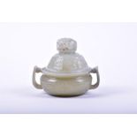 A finely carved 19th century Chinese celadon jade lidded censer the twin-handled bowl with finely