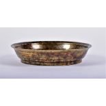 A late 19th/early 20th century Chinese bronze bowl with speckled gilt interior and circular ridged