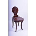 A small Victorian mahogany hall chair  The stepped roundall back over swept forelegs, 82 cm high.