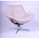 A contemporary cream leather swivel armchair on a chrome base, 83 cm wide.