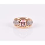 A 9ct yellow gold, Madagascan morganite, and white sapphire ring set with an oval-cut morganite of