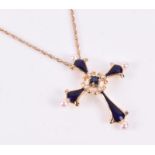 From the House of Igor Carl Faberge, a yellow metal and enamel cross pendant set with a sapphire and