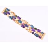 Marco Bicego. A yellow gold and multi-gem bracelet the mounts and clasp with matte finish, the