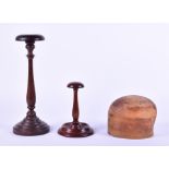 Two 19th century mahogany wig stands together with a hat mould. (3)
