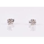 A pair of 18ct white gold and solitaire diamond ear studs each set with a round brilliant-cut