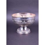 A Rangoon silver pedestal bowl the body decorated in relief with figures and landscape, stamped '