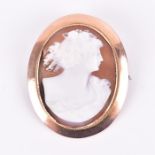 A late 19th / early 20th century 9ct yellow gold mounted shell cameo brooch of oval form,