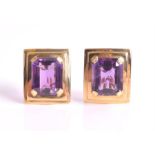 A pair of amethyst earrings each set with an emerald-cut amethyst weighing approximately 10.60