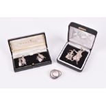 A novelty silver brooch and cufflinks retailed by Martick, comprising a pair of cufflinks in the