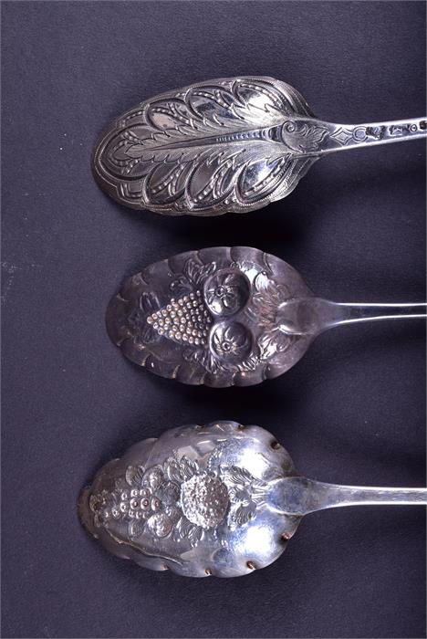 A collection of 18th century and later silver fruit spoons comprising one trio and two pairs, - Image 2 of 9