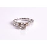 A 14ct white gold solitaire diamond ring centred with a round brilliant-cut diamond of approximately