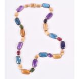 Marco Bicego. An 18ct yellow gold and gem set necklace set with mixed faceted rectangular-cut