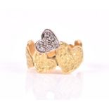 An 18ct yellow gold and diamond ring in the form of connected hearts, one set with diamonds, size L,