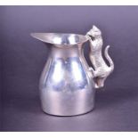 An English silver milk jug designed with a cat handle by N.P, London, 2000, the car realistically