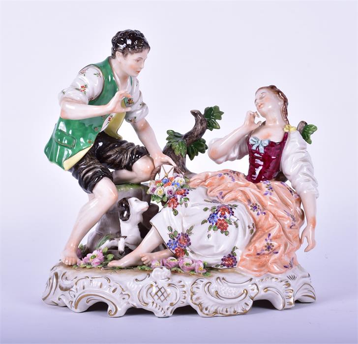 A Rudolph Kammer porcelain figure group  of a pair of lovers with their dog, the male slipping