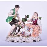 A Rudolph Kammer porcelain figure group  of a pair of lovers with their dog, the male slipping