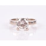 A solitaire diamond ring set with a round brilliant-cut diamond weighing approximately 1.80
